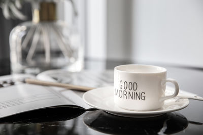 Close-up of coffee cup on table