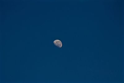 Low angle view of moon against clear sky