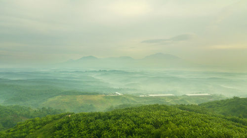 Aerial view of landscape during foggy weather
