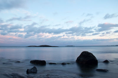 Scenic view of sea against cloudy sky