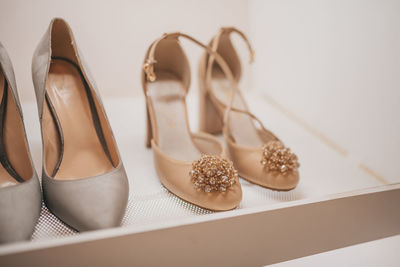 Close-up of shoes against white background