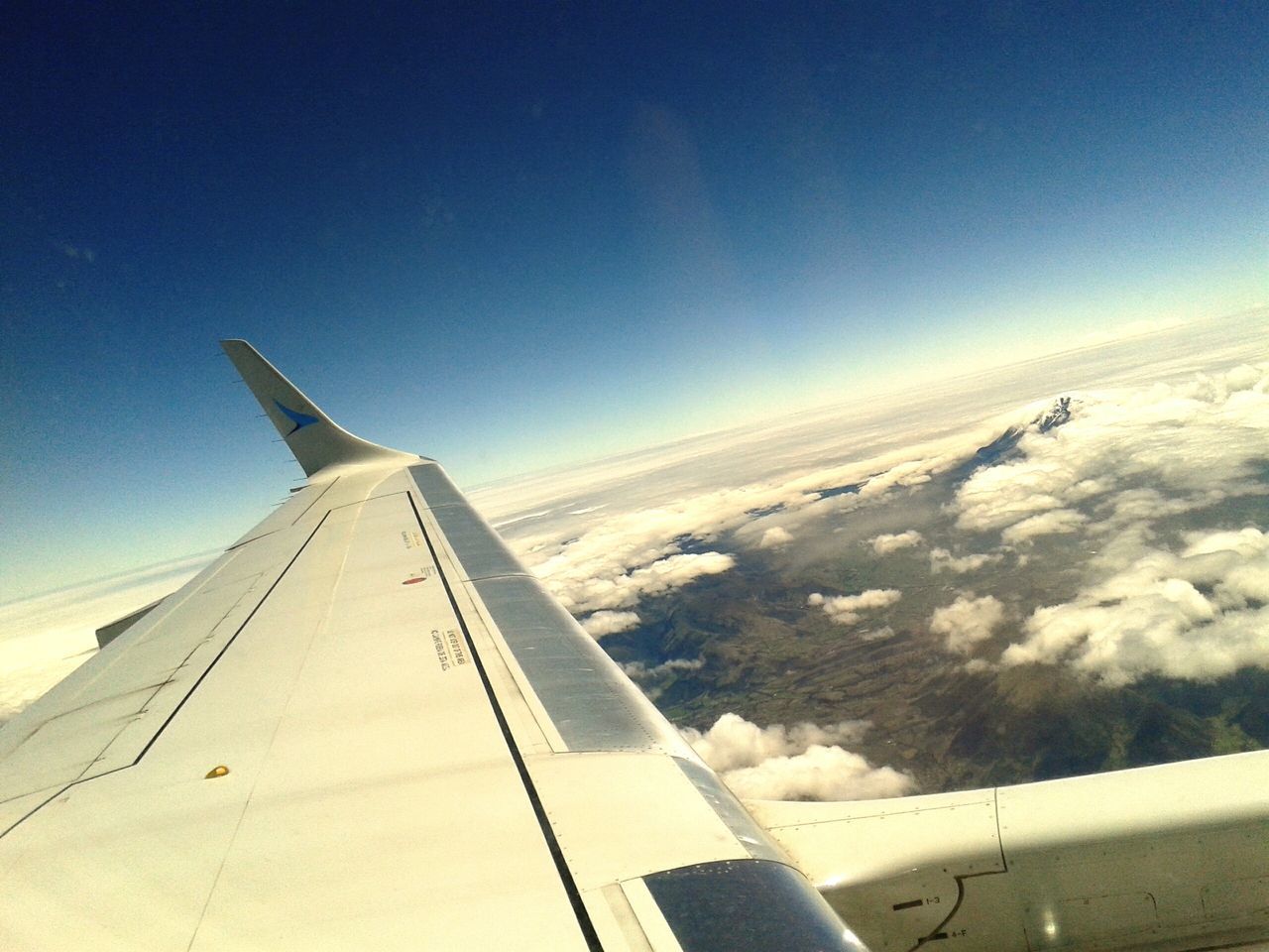 transportation, airplane, aircraft wing, air vehicle, mode of transport, flying, cropped, part of, landscape, sky, travel, aerial view, public transportation, journey, on the move, blue, clear sky, scenics, nature, copy space