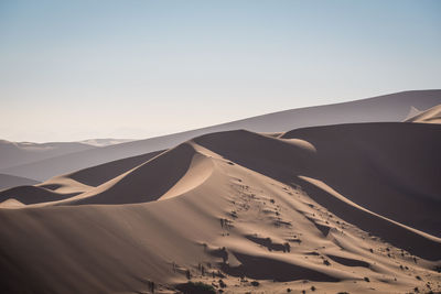 Scenic view of desert against clear sky