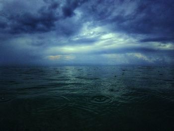 Scenic view of sea against sky at dusk