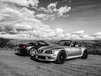 Vintage car on field against sky