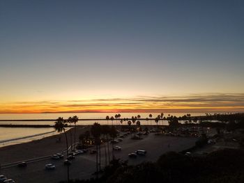 Scenic view of beach against sky during sunset