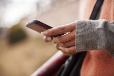 Close-up of person using mobile phone