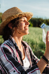 Woman drinking water from bottle