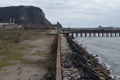 Bridge over sea against sky