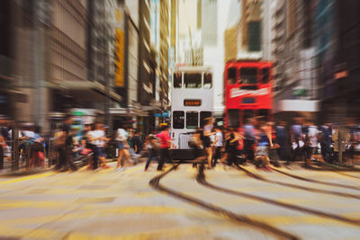 Blurred motion of people on city street