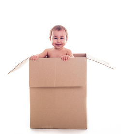 Portrait of smiling boy against white background