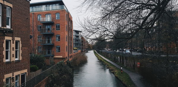 Canal amidst buildings in city