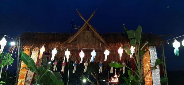 Panoramic shot of illuminated lighting equipment against clear sky at night