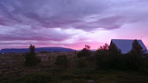 Scenic view of landscape against cloudy sky