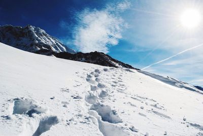 Scenic view of snowcapped mountain against sky