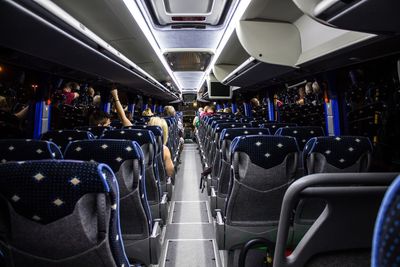 Rear view of passengers inside bus