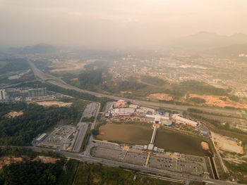 High angle view of buildings in city against sky