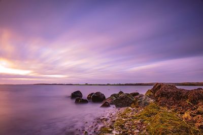 Scenic view of sea against sky during sunset