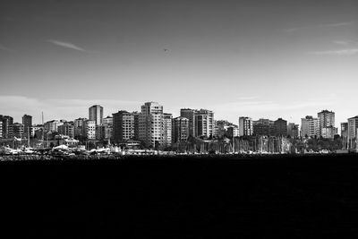 Modern buildings in city against sky