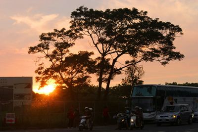 Car on road at sunset