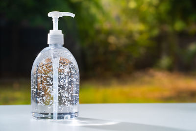 Close-up of water bottle on table