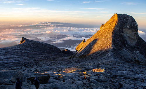 Scenic view of snowcapped mountains against sky during sunset