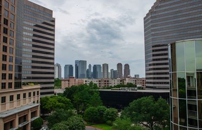 Buildings in city against sky