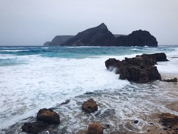 Waves against rocks in porto santo island 