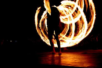 Blurred motion of illuminated lighting equipment at night