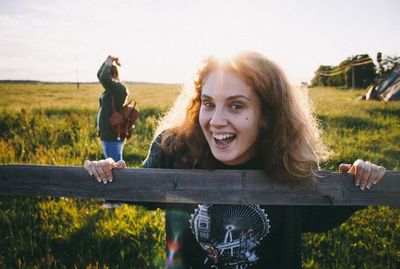 Portrait of woman standing on field