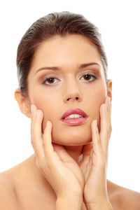 Portrait of a beautiful young woman over white background