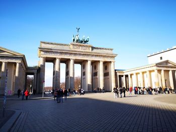 Group of people in front of historical building