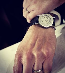 Close-up of man hand on table