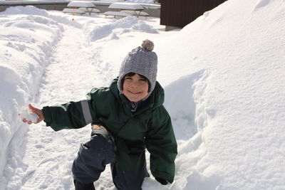 Portrait of boy skiing on snow