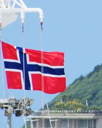 Close-up of flag against clear blue sky