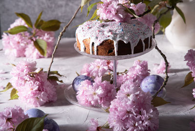 Beautiful easter cake on the table, and colored eggs, homemade cakes, still life