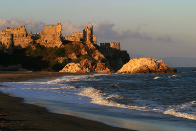 Scenic view of sea and buildings against sky