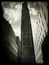 Low angle view of building against cloudy sky