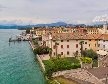 High angle view of townscape by sea