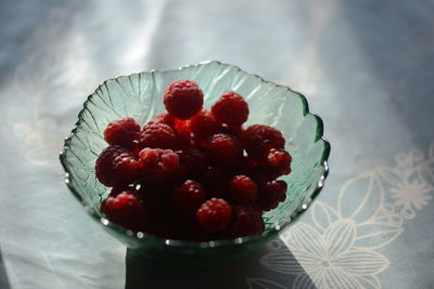 High angle view of strawberries in bowl on table