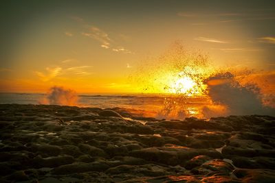 Scenic view of sea against sky during sunset