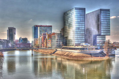 Buildings in city against sky