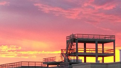 Built structure against sky during sunset