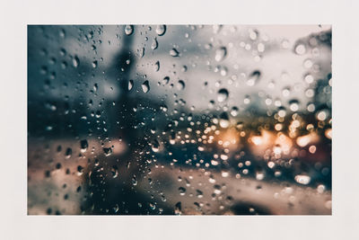 Full frame shot of wet glass window in rainy season