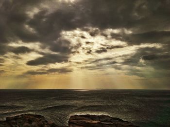 Scenic view of sea against sky at sunset