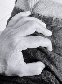 Close-up of man holding hands