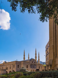 Low angle view of buildings against blue sky