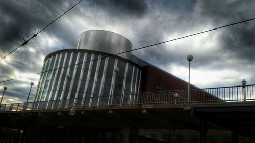 Low angle view of building against cloudy sky