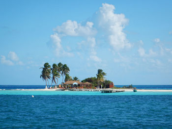 Scenic view of swimming pool by sea against sky