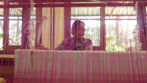 View of woman standing on bed